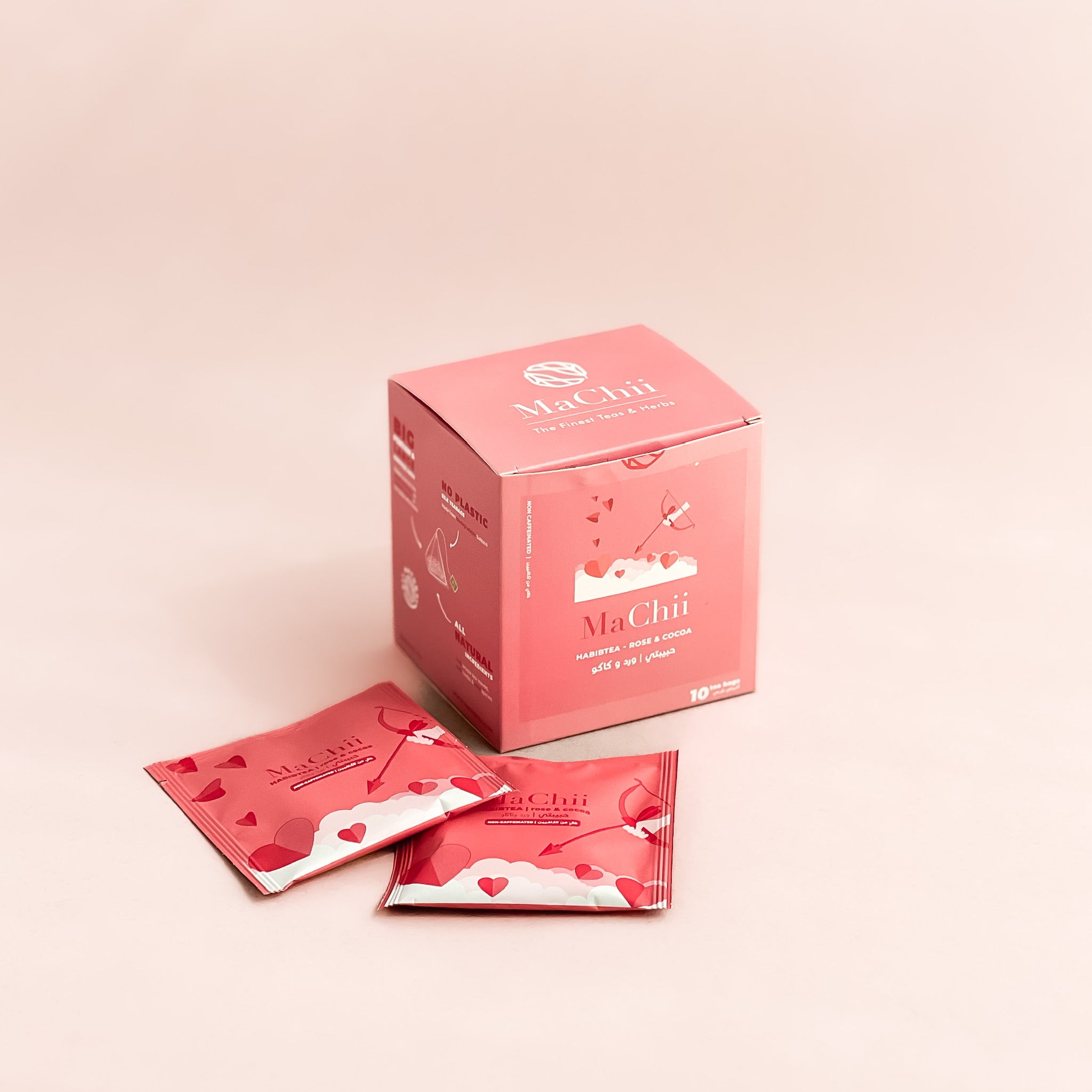 organic cocoa and rose tea in a pink envelope tea bag next to a box of 10 teabags.