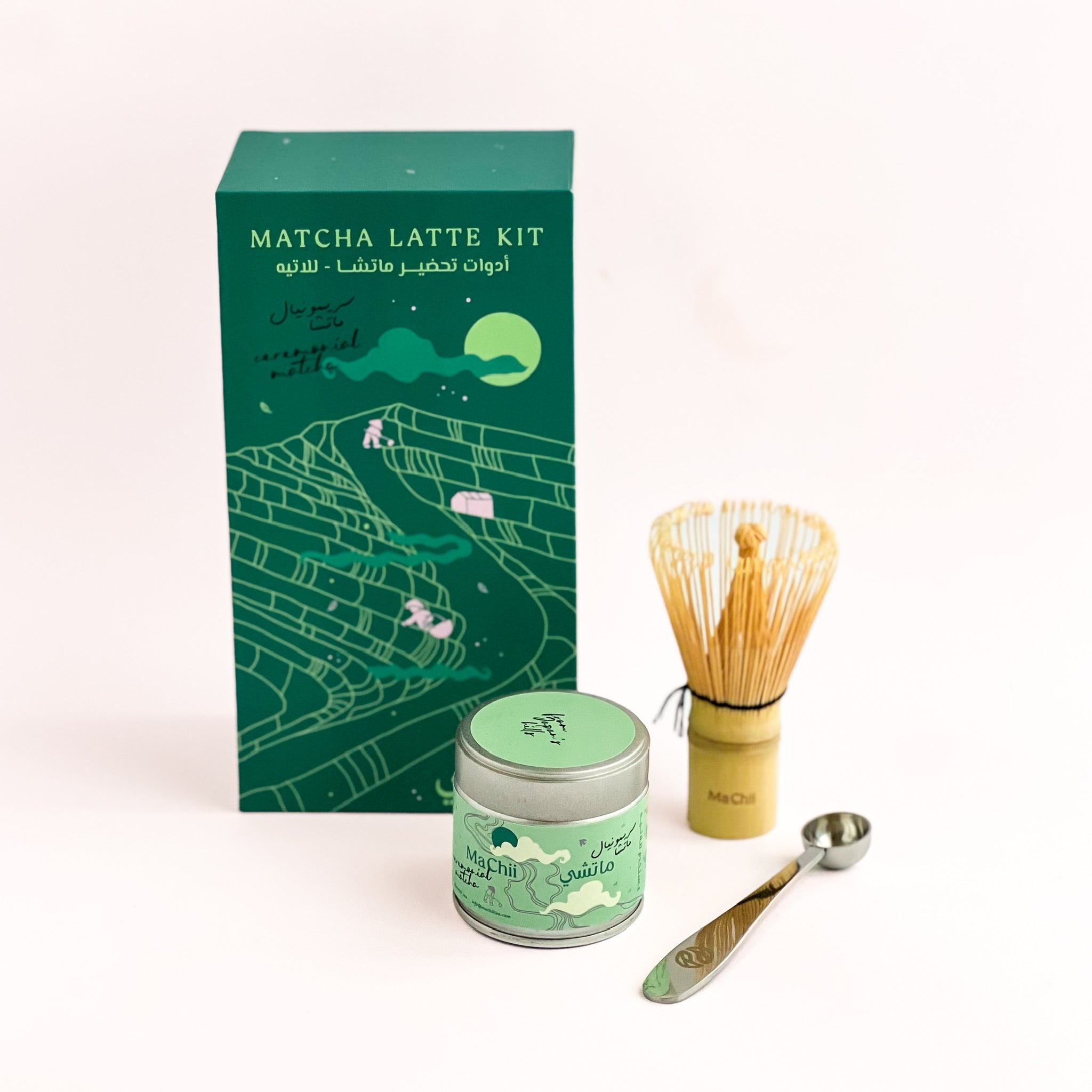 matcha kit box with ceremonial matcha for lattes tin, matcha spoon and bamboo matcha whisk to the side. MaChii Tea logo