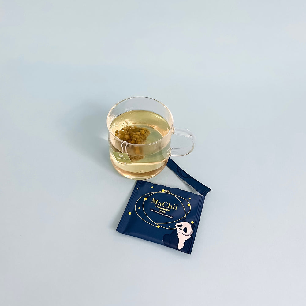 Organic chamomile tea brewing in a glass cup for wholesale in a cafe