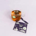 premium earl grey royal tea bag brewing in a cup. 