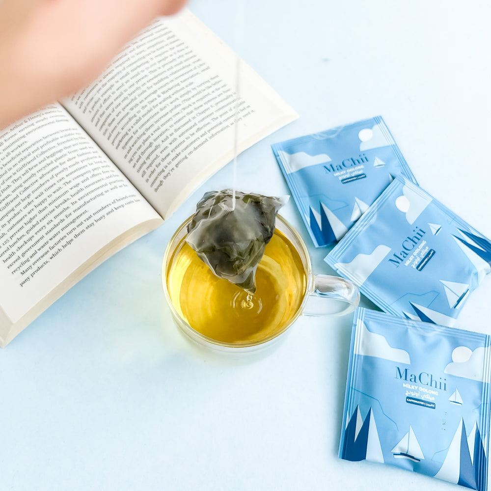 
                  
                    reading a book with a cup of organic milky oolong tea. brewing the tea and throwing away the tea bag.
                  
                