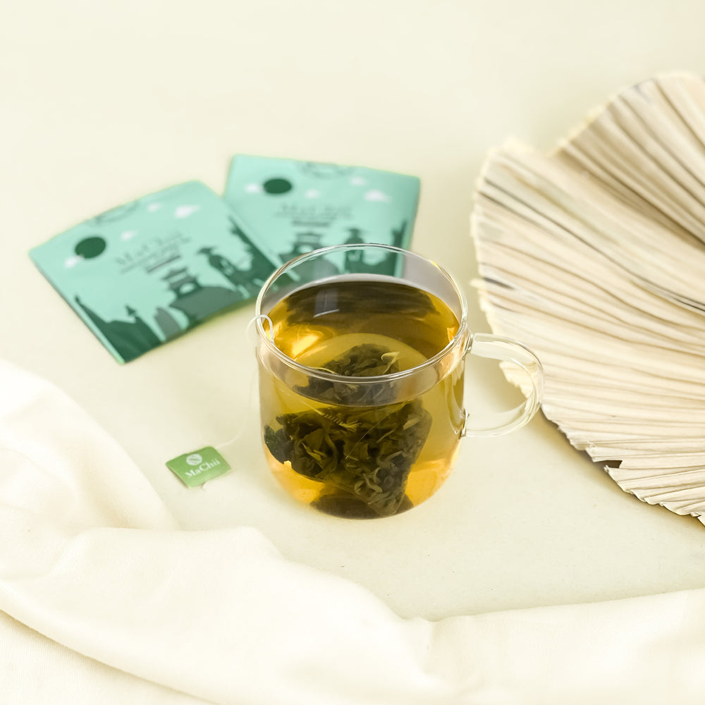 
                  
                    Chinese pinhead gunpowder been tea brewing in a cup. organic and biodegradable silk tea bag and enevlope
                  
                