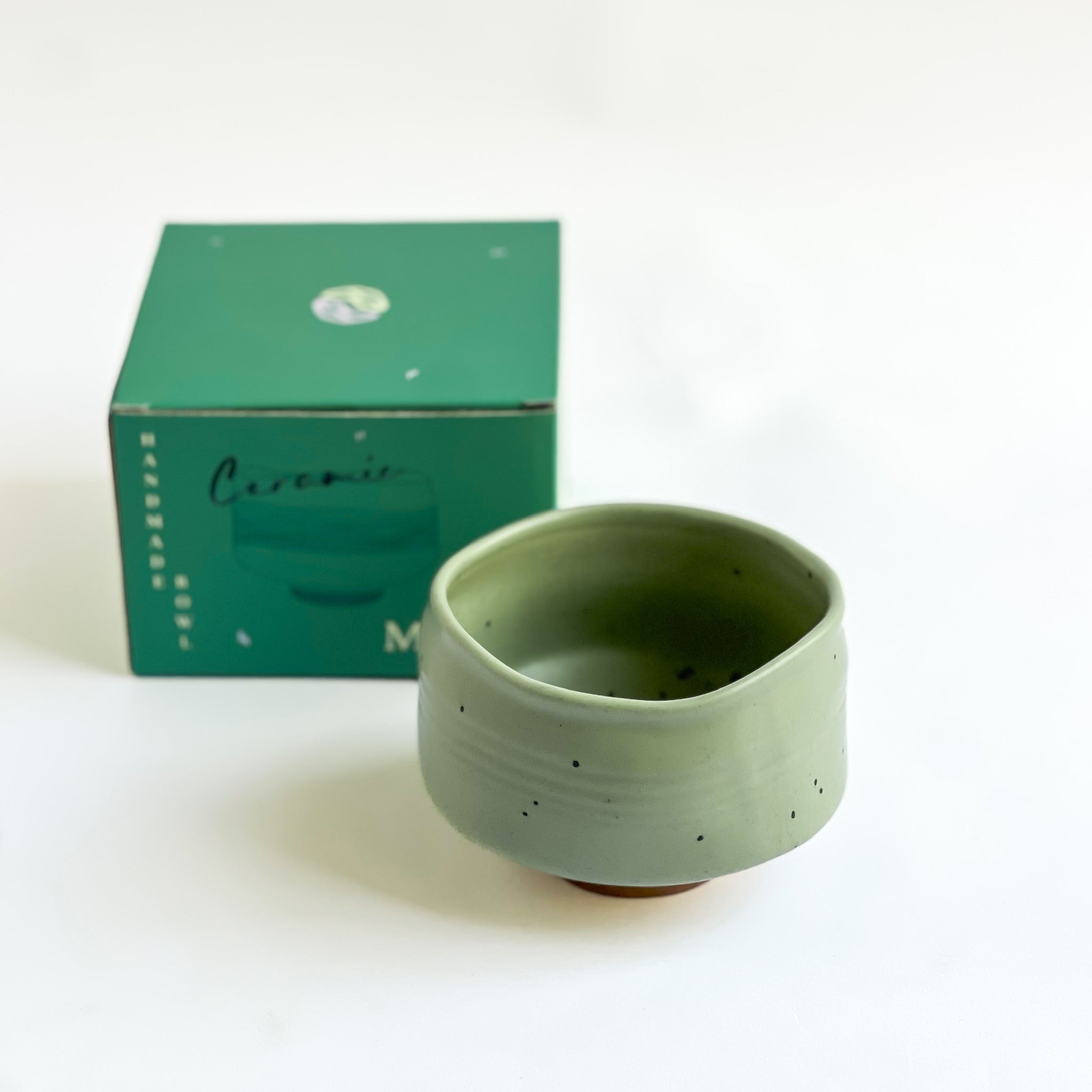 handmade green matcha bowl next to MaChii Tea box